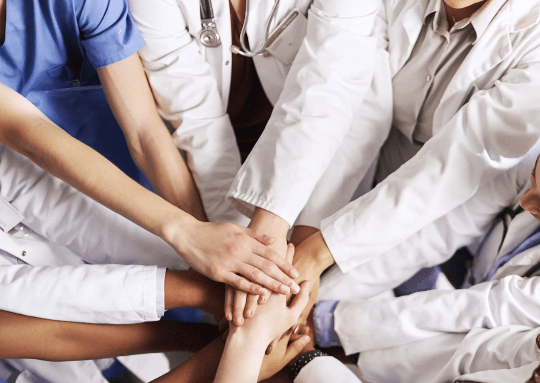 Healthcare team hands.